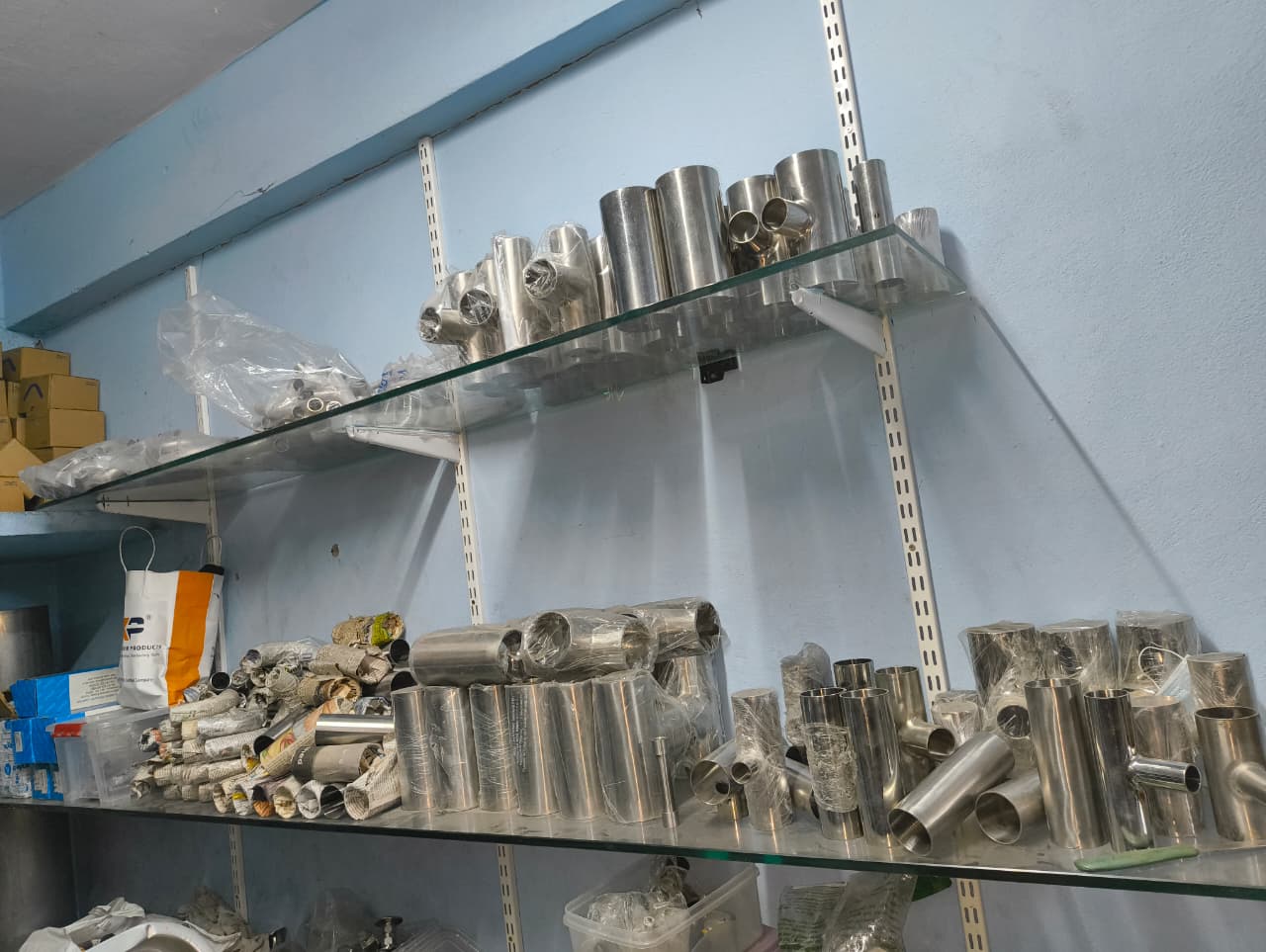 SS equal tees and short pipes on shelf